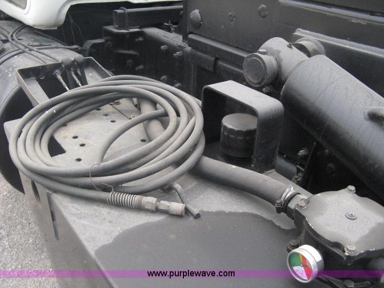 image for item A6153 1989 Mack R688ST tandem axle roll off truck