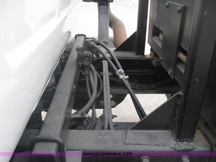 image for item A6153 1989 Mack R688ST tandem axle roll off truck