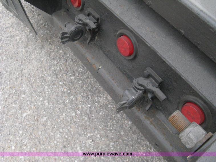 image for item A6153 1989 Mack R688ST tandem axle roll off truck