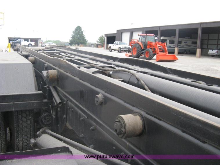 image for item A6153 1989 Mack R688ST tandem axle roll off truck