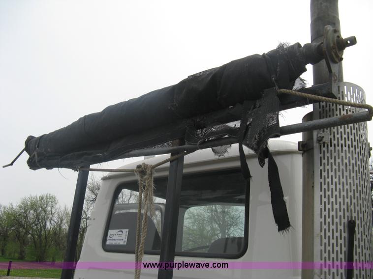 image for item A6153 1989 Mack R688ST tandem axle roll off truck