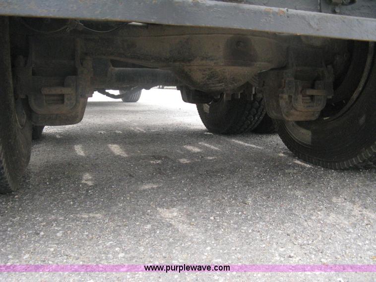 image for item A6153 1989 Mack R688ST tandem axle roll off truck