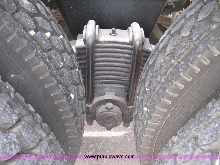 image for item A6153 1989 Mack R688ST tandem axle roll off truck