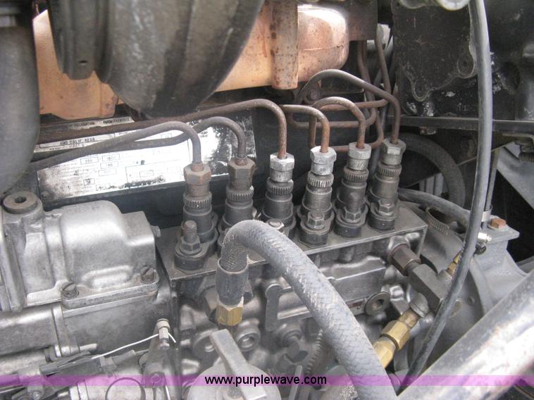 image for item A6153 1989 Mack R688ST tandem axle roll off truck