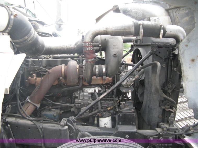 image for item A6153 1989 Mack R688ST tandem axle roll off truck