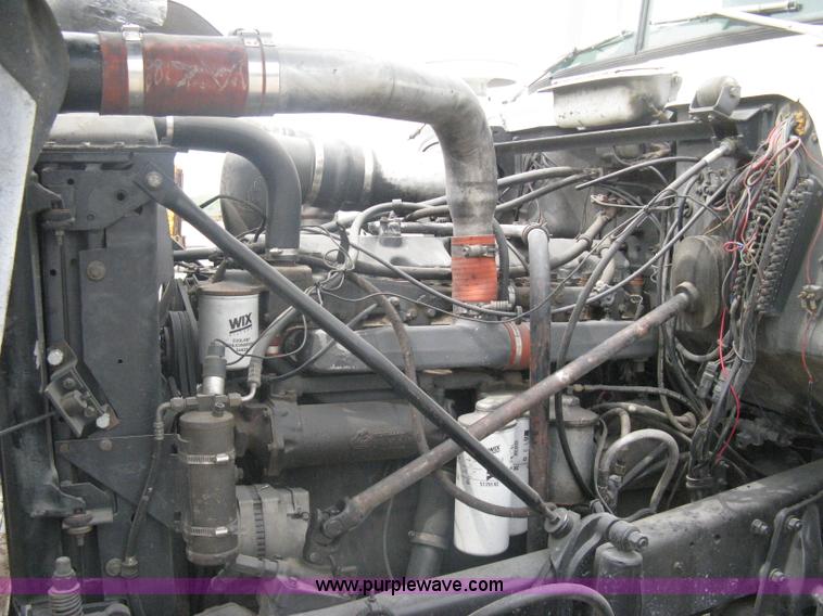 image for item A6153 1989 Mack R688ST tandem axle roll off truck