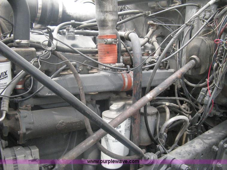 image for item A6153 1989 Mack R688ST tandem axle roll off truck