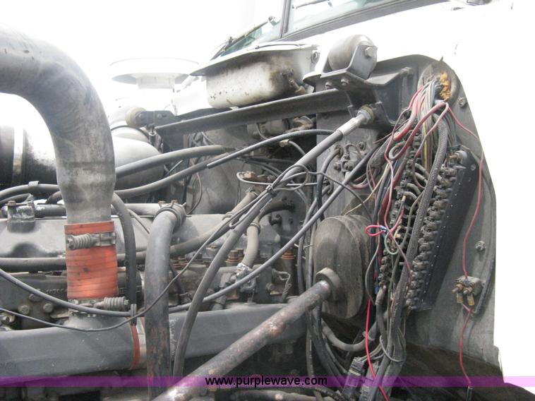 image for item A6153 1989 Mack R688ST tandem axle roll off truck