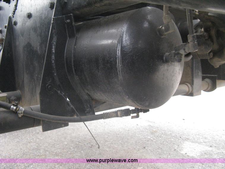 image for item A6153 1989 Mack R688ST tandem axle roll off truck