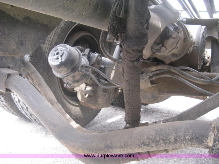 image for item A6153 1989 Mack R688ST tandem axle roll off truck