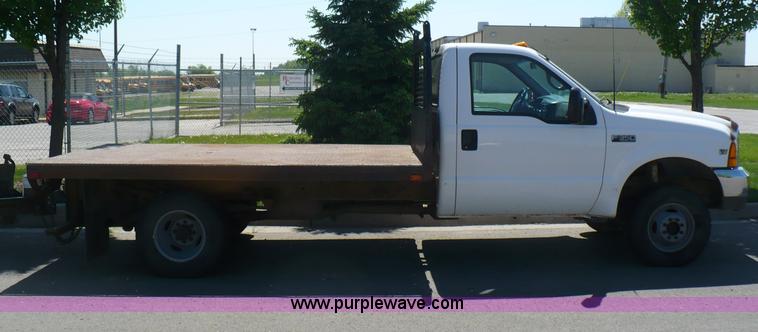 image for item B6323 1999 Ford F350 XLT Super Duty flatbed pickup truck