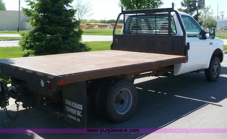 image for item B6323 1999 Ford F350 XLT Super Duty flatbed pickup truck