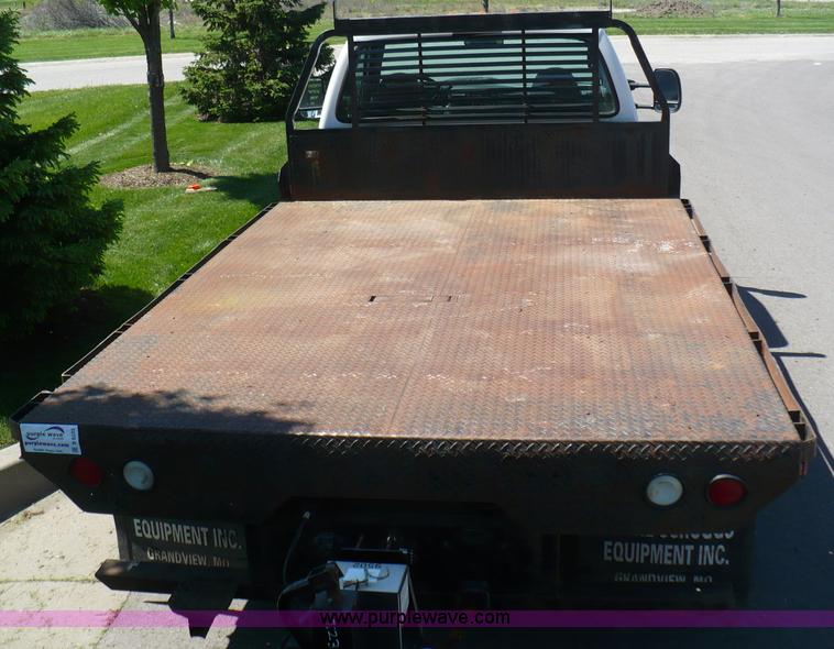 image for item B6323 1999 Ford F350 XLT Super Duty flatbed pickup truck
