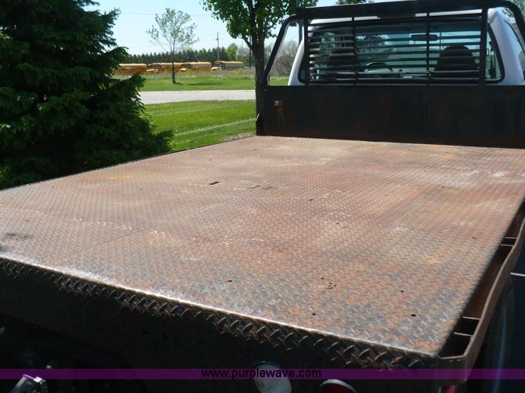 image for item B6323 1999 Ford F350 XLT Super Duty flatbed pickup truck