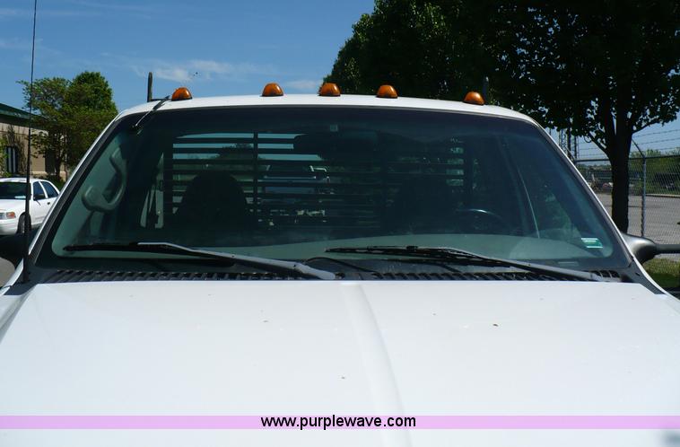 image for item B6323 1999 Ford F350 XLT Super Duty flatbed pickup truck