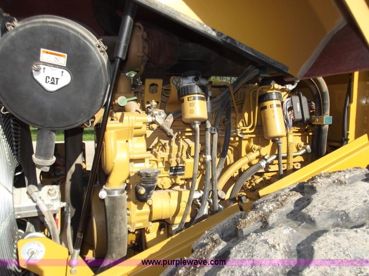 image for item B6343 2007 Caterpillar CS563E smooth drum roller with padfoot kit