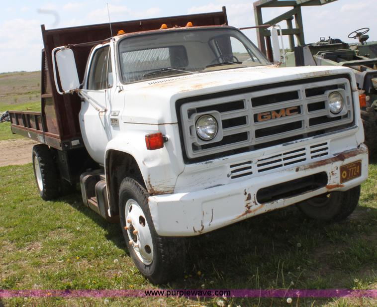 image for item D7697 1979 GMC 6000 flatbed dump truck