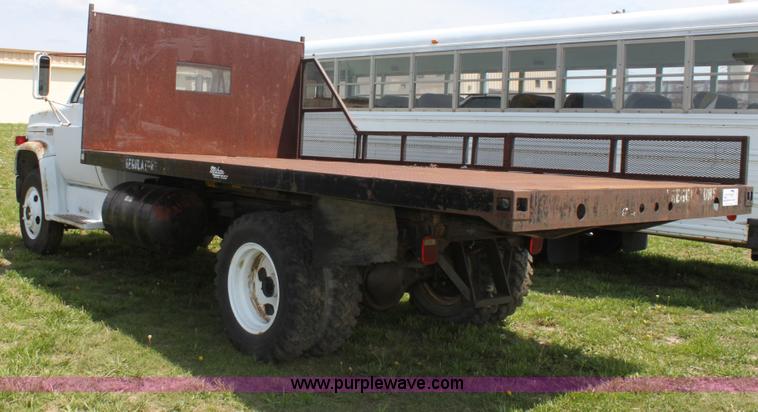 image for item D7697 1979 GMC 6000 flatbed dump truck