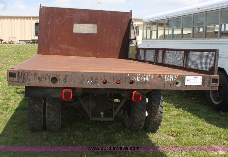 image for item D7697 1979 GMC 6000 flatbed dump truck