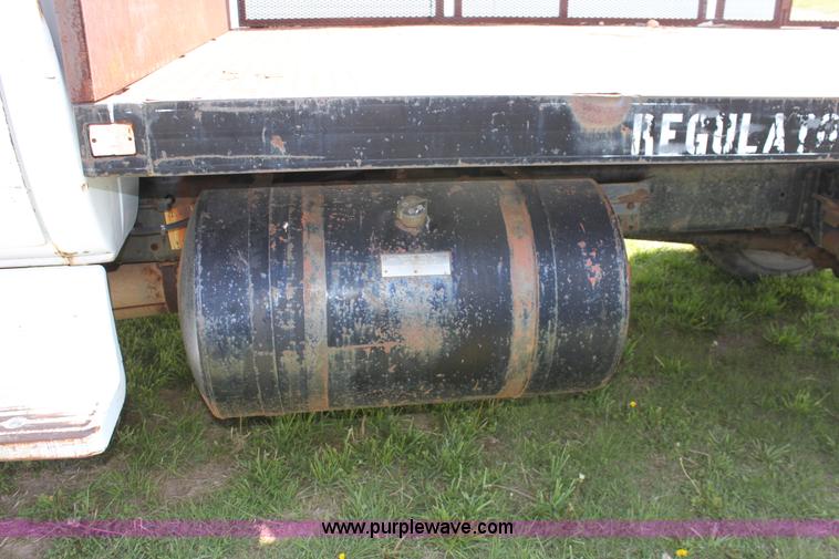 image for item D7697 1979 GMC 6000 flatbed dump truck