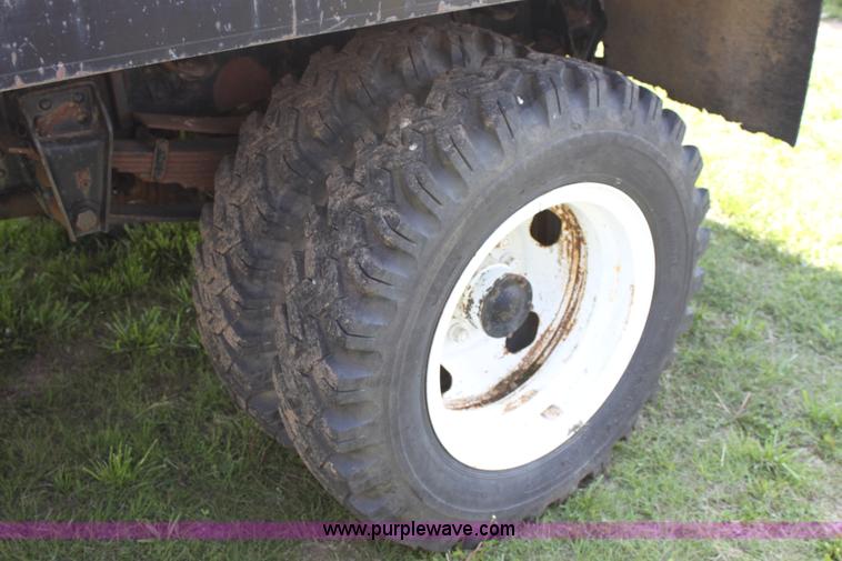 image for item D7697 1979 GMC 6000 flatbed dump truck