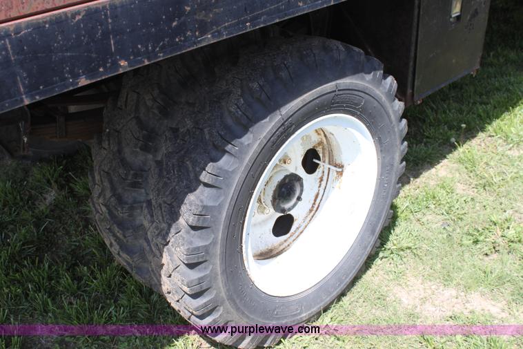 image for item D7697 1979 GMC 6000 flatbed dump truck