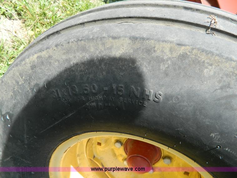 image for item B3657 New Holland 1475 hydro swing swather