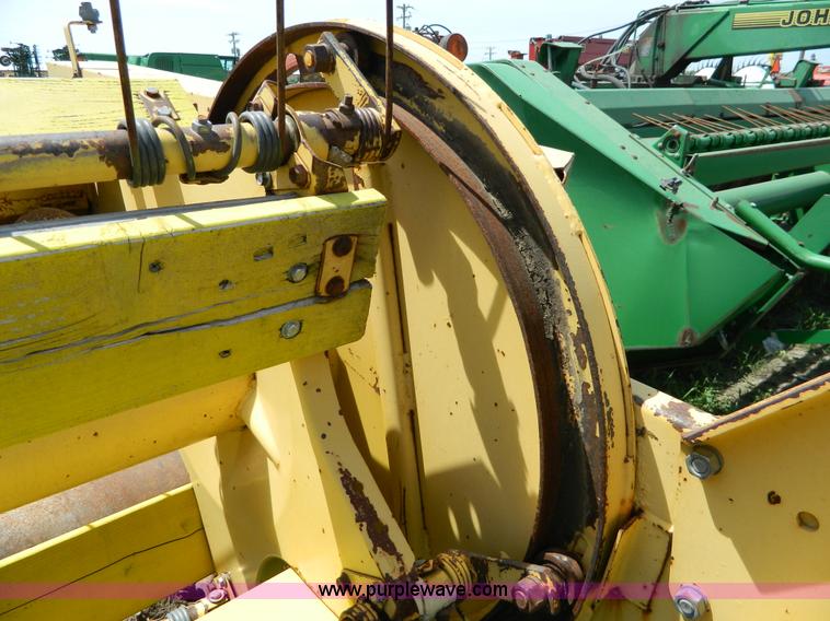 image for item B3657 New Holland 1475 hydro swing swather