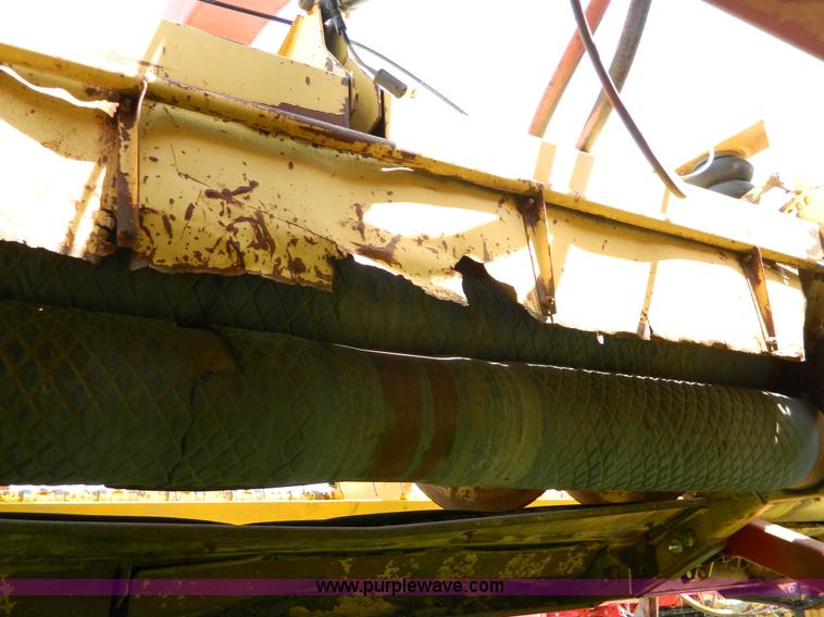 image for item B3657 New Holland 1475 hydro swing swather