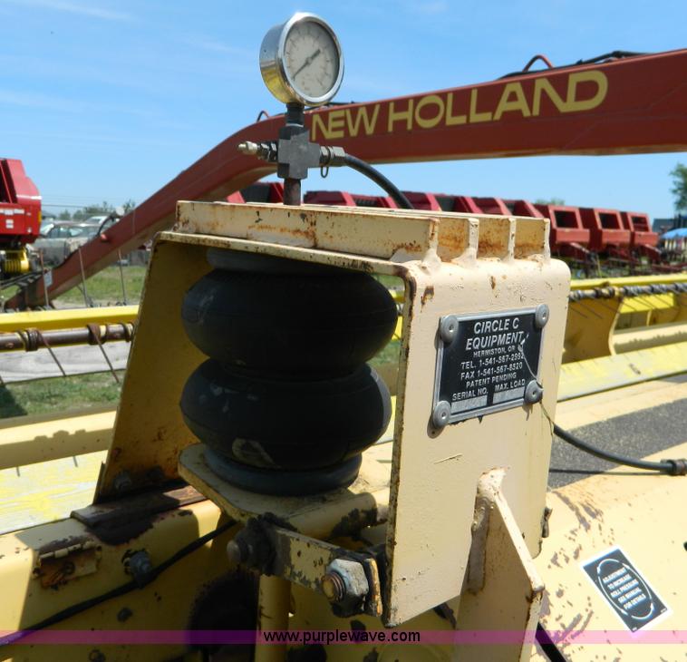 image for item B3657 New Holland 1475 hydro swing swather