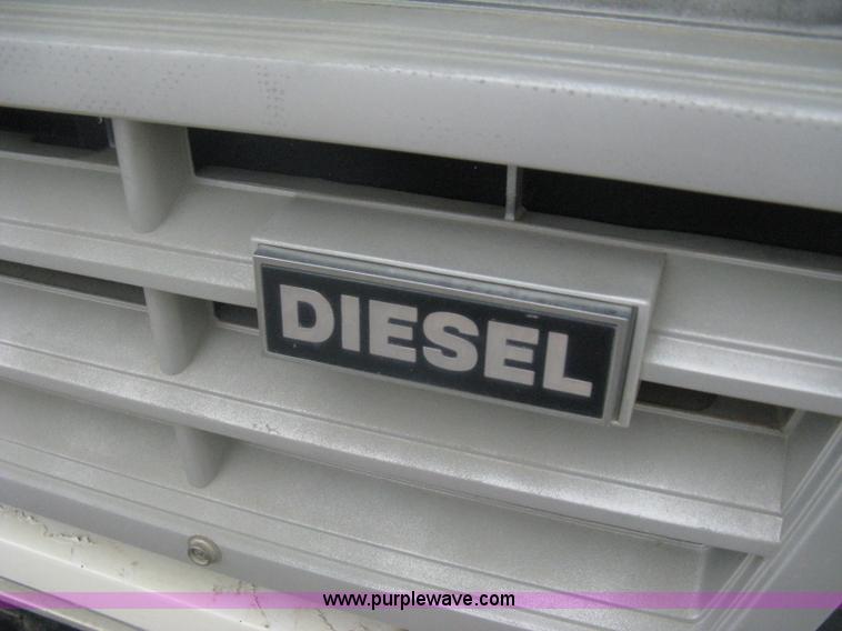 image for item A6307 1991 Ford F700 flatbed dump truck