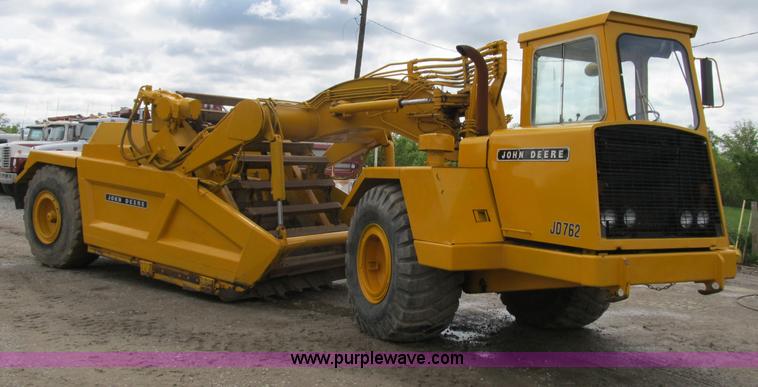 image for item B2697 1983 John Deere 762 paddle wheel scraper