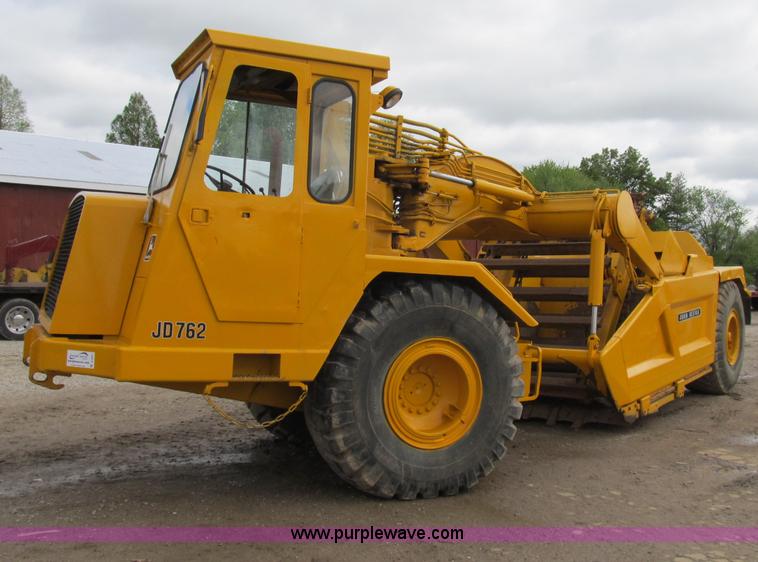 image for item B2697 1983 John Deere 762 paddle wheel scraper