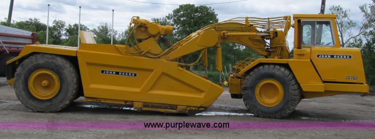 image for item B2697 1983 John Deere 762 paddle wheel scraper
