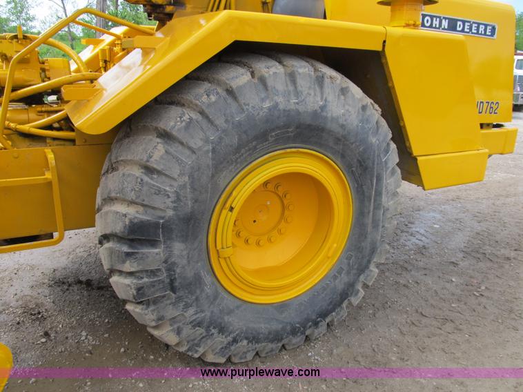 image for item B2697 1983 John Deere 762 paddle wheel scraper