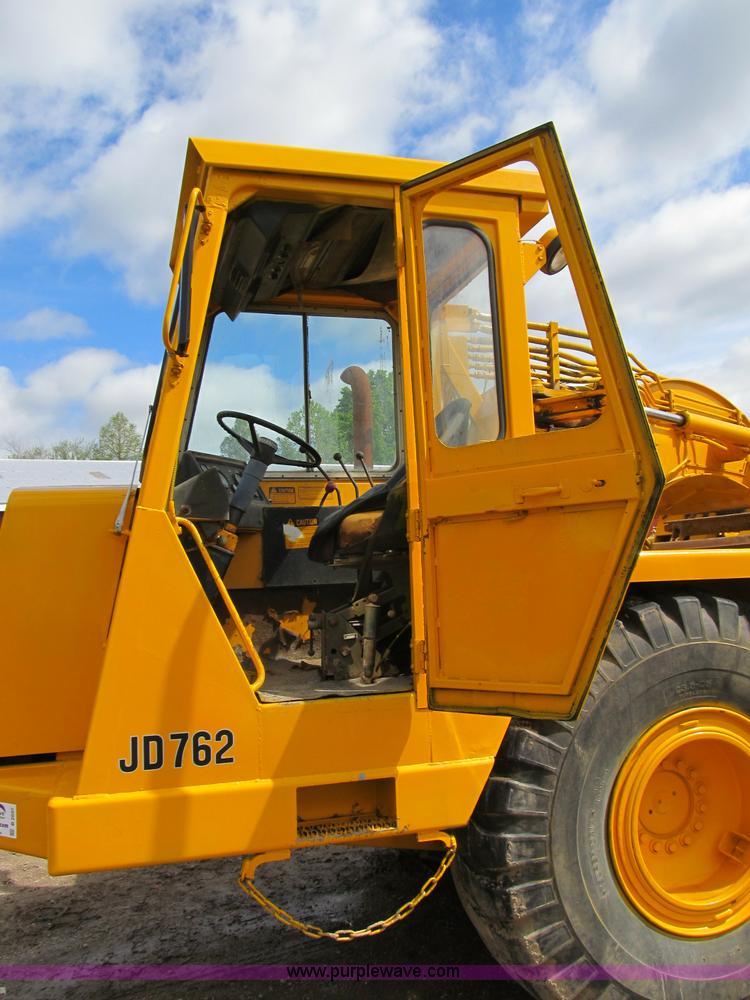 image for item B2697 1983 John Deere 762 paddle wheel scraper