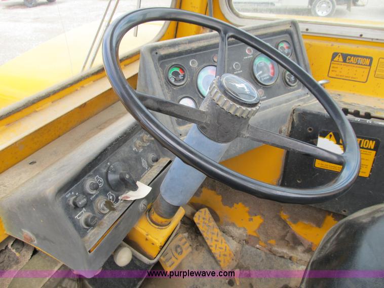 image for item B2697 1983 John Deere 762 paddle wheel scraper