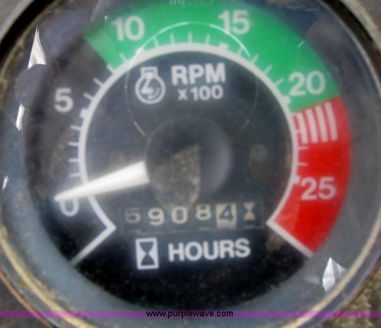 image for item B2697 1983 John Deere 762 paddle wheel scraper