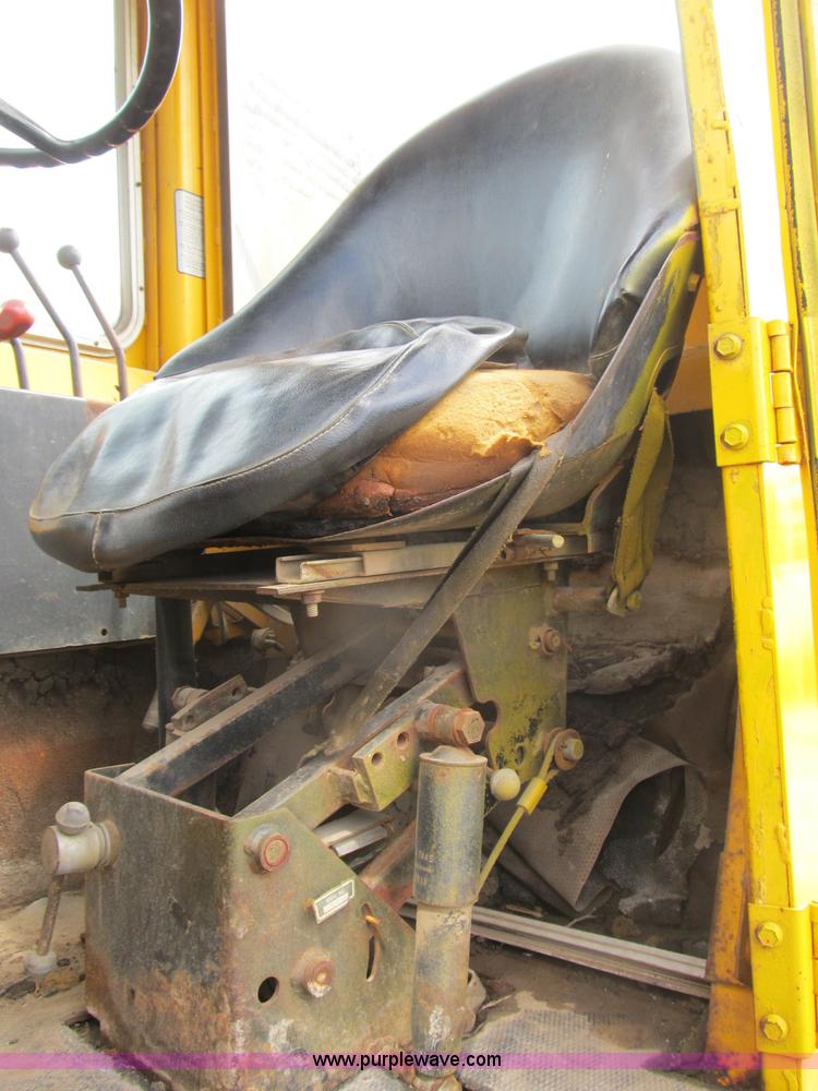 image for item B2697 1983 John Deere 762 paddle wheel scraper