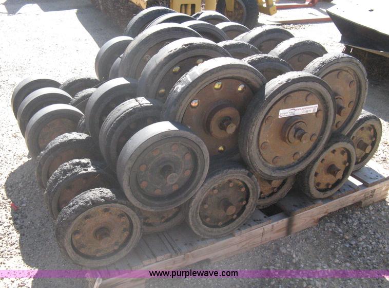 image for item G9811 Caterpillar 277 skid loader undercarriage rollers