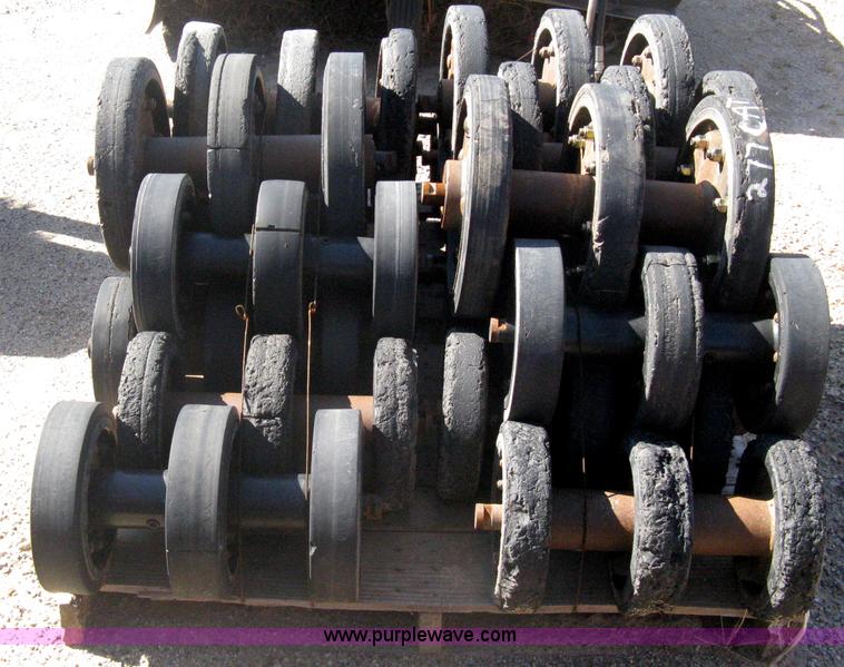 image for item G9811 Caterpillar 277 skid loader undercarriage rollers