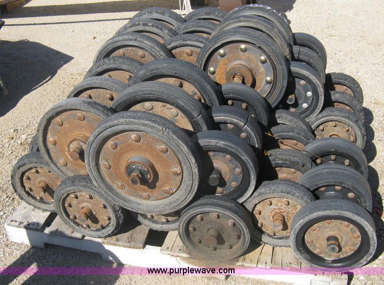 image for item G9811 Caterpillar 277 skid loader undercarriage rollers