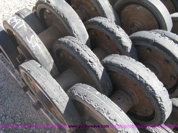 image for item G9811 Caterpillar 277 skid loader undercarriage rollers