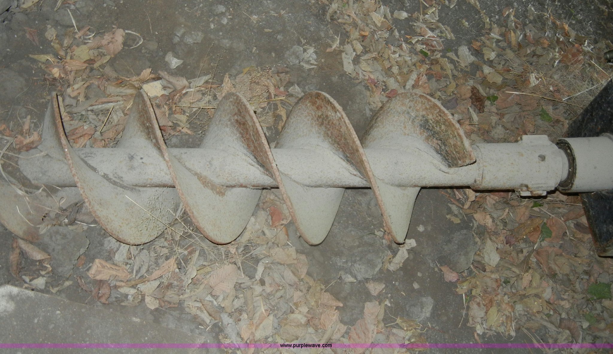 Lowe hydraulic post hole digger skid steer attachment in KS