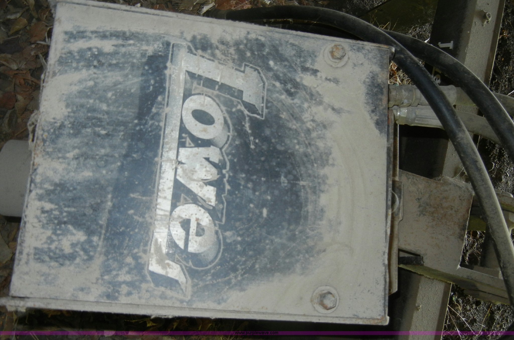 Lowe hydraulic post hole digger skid steer attachment in KS