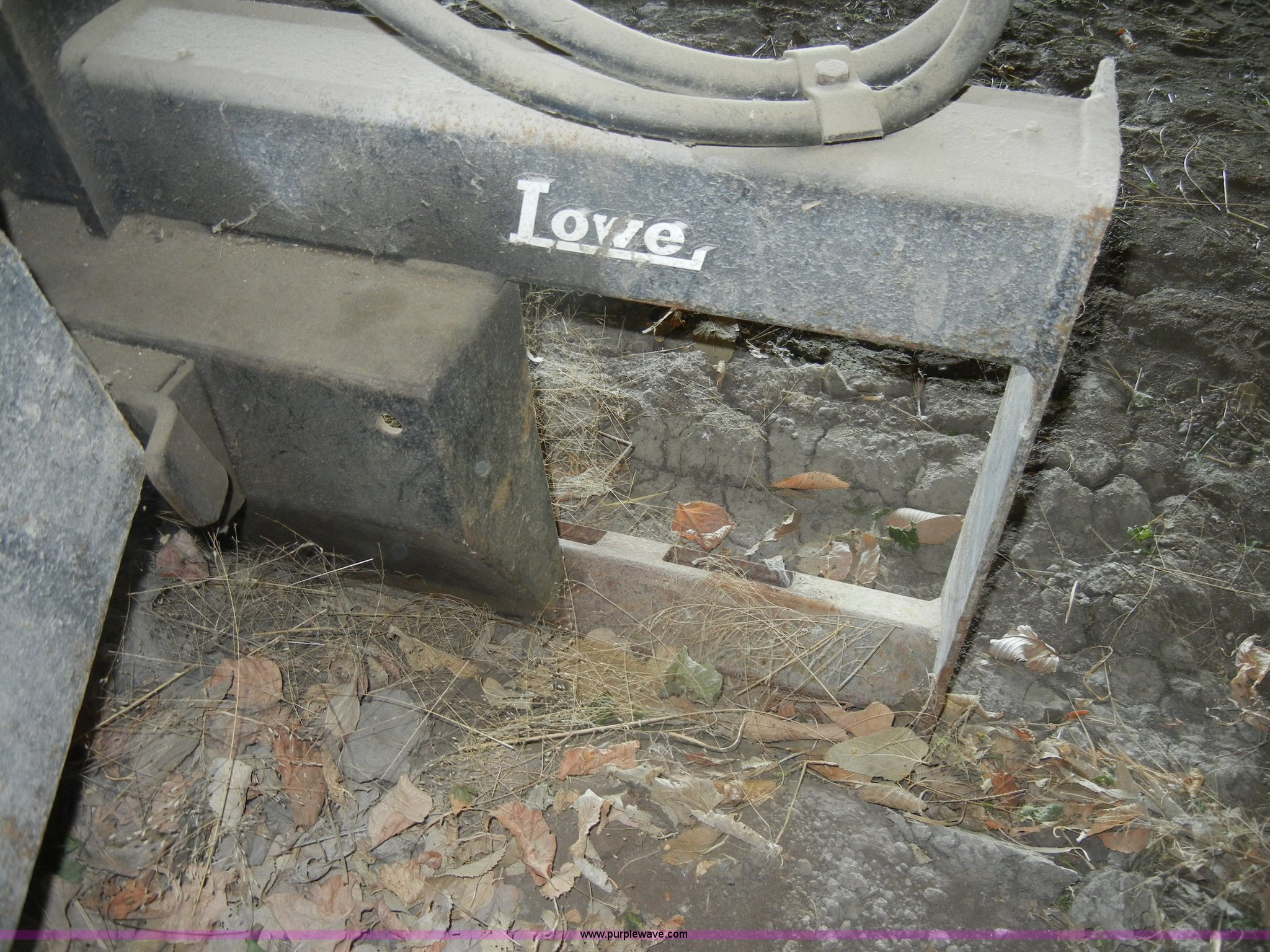 Lowe hydraulic post hole digger skid steer attachment in KS