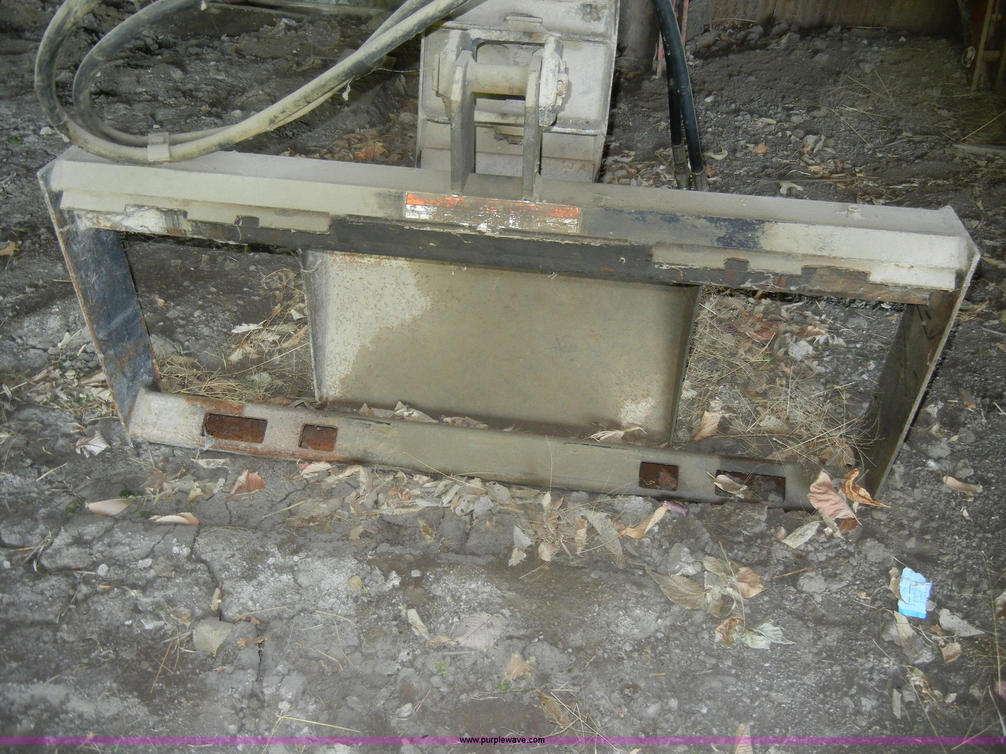 Lowe hydraulic post hole digger skid steer attachment in KS