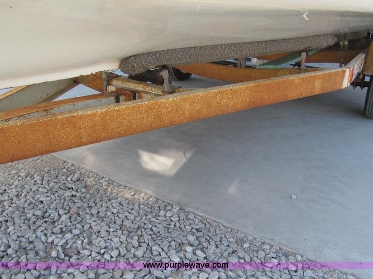 image for item B5131 1972 Anchor Plastics 614DVG 15 1/2' deck boat with Golden Rod trailer