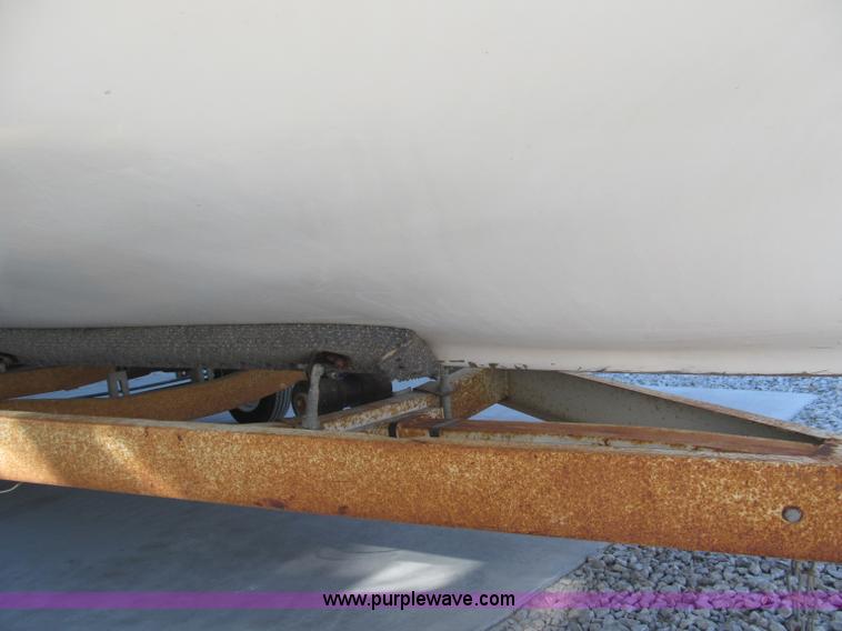 image for item B5131 1972 Anchor Plastics 614DVG 15 1/2' deck boat with Golden Rod trailer