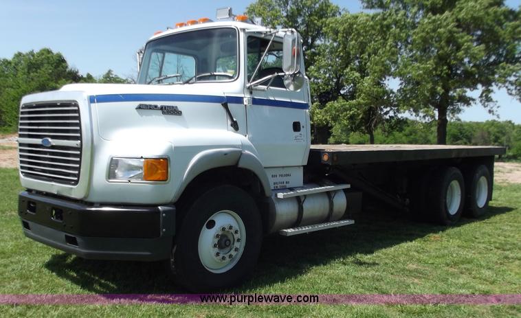 image for item C2024 1996 Ford LTA9000 AeroMax flatbed dump truck